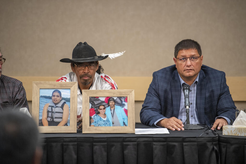 Mark Arcand, right, who's sister Bonnie Burns and nephew Mark Arcand, right, who's sister Bonnie Burns and nephew Gregory "Jonesy" Burns were killed during a series of violence attacks at James Smith Cree Nation and Brian "Buggy" Burns, Bonnie Burns's husband, speak to media at a press conference in Saskatoon, Wednesday, Sept.  7, 2022.  Myles Sanderson, 32, and his brother Damien, 30, are accused of killing 10 people and wounding 18 in a string of attacks across an Indigenous reserve and in the nearby town of Weldon. Damien was found dead Monday, and police were investigating whether his own brother killed him.   (Liam Richards /The Canadian Press via AP)