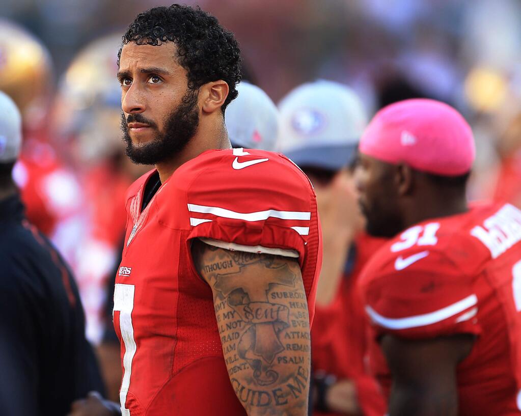 Colin Kaepernick can only watch as time ticks away in the fourth quarter during the 49ers 17-3 loss to the Green Bay Packers in Santa Clara, Sunday Oct. 4, 2015. (Kent Porter / Press Democrat) 2015