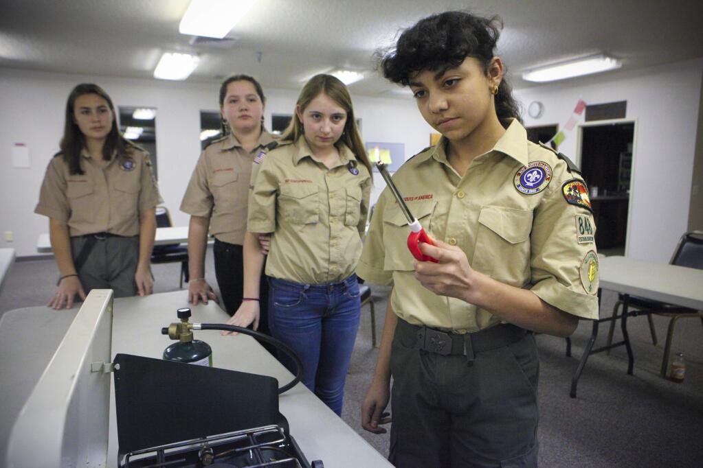 Ivy Robertson, 12, gets some hands-on practice using a camp stove during a scout meeting at the Church of Christ where they discussed an upcoming camping trip. This is the first all-girl troop of the Boys Scouts in Petaluma. (CRISSY PASCUAL/ARGUS-COURIER STAFF)