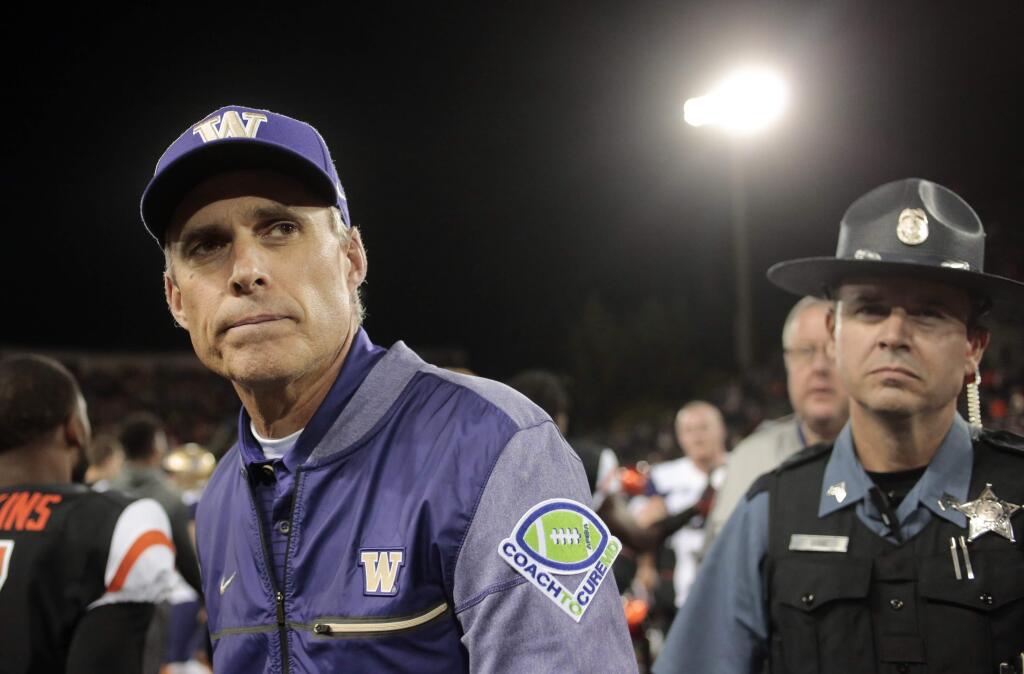 In this Sept. 30, 2017, file photo, Washington head coach Chris Petersen after a game against Oregon State in Corvallis, Ore. Pac-12 After Dark, those West Coast TV games that start at about 11 p.m. on the East Coast, are the talk of the conference after Washington coach Chris Petersen weighed in. Some say it's a great showcase for the conference, but at least one coach said the next day, his team is basically zombies. (AP Photo/Timothy J. Gonzalez, File)