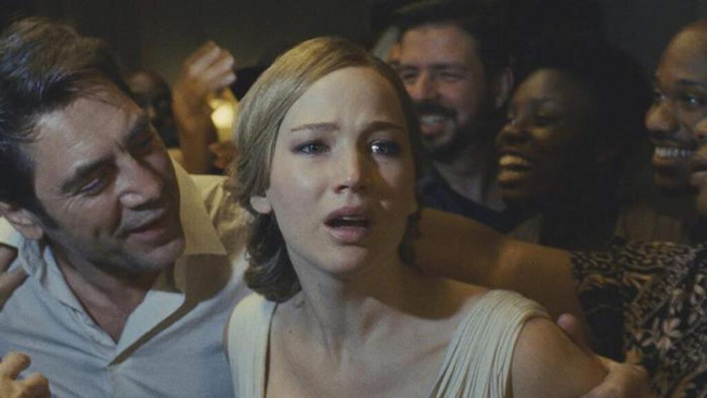 Jennifer Lawrence is beset by mysterious waves of visitors with Javier Bardem, left, in writer-director Darren Aronofsky's bizarre, controversial thriller, 'Mother!' (PARAMOUNT PICTURES)