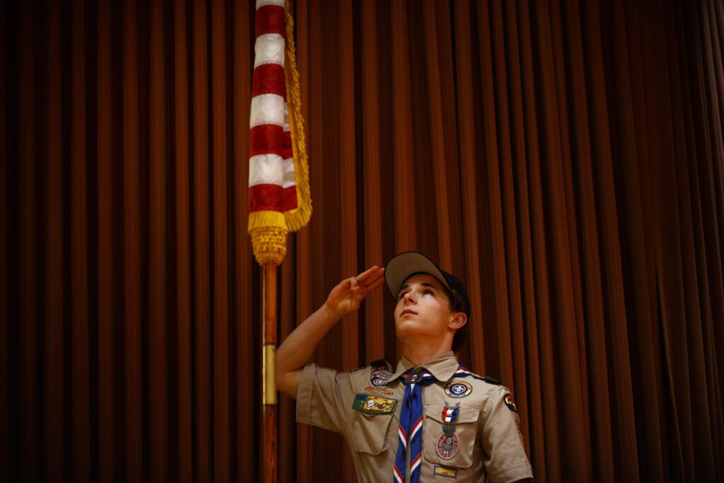 Eagle Scout Christopher Gullixson, 18, of Troop 32 saluting the American flag during the Distinguished Citizen Dinner, hosted by the Redwood Empire Council, Boy Scouts of America, and held Friday at the Flamingo Conference Resort and Spa in Santa Rosa. January 12, 2017.(Photo: Erik Castro/for The Press Democrat)