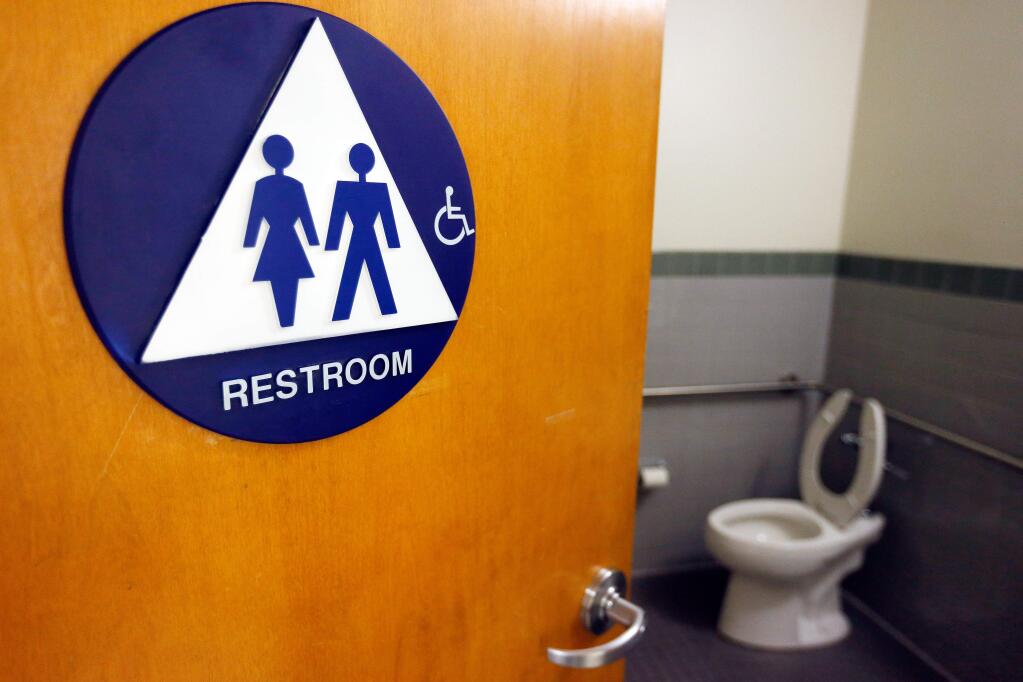 A unisex restroom at the Sonoma County administration center in Santa Rosa, California on Wednesday, December 28, 2016. A new state law requres single-toilet restrooms to be designated as gender neutral or unisex restrooms. (Alvin Jornada / The Press Democrat)
