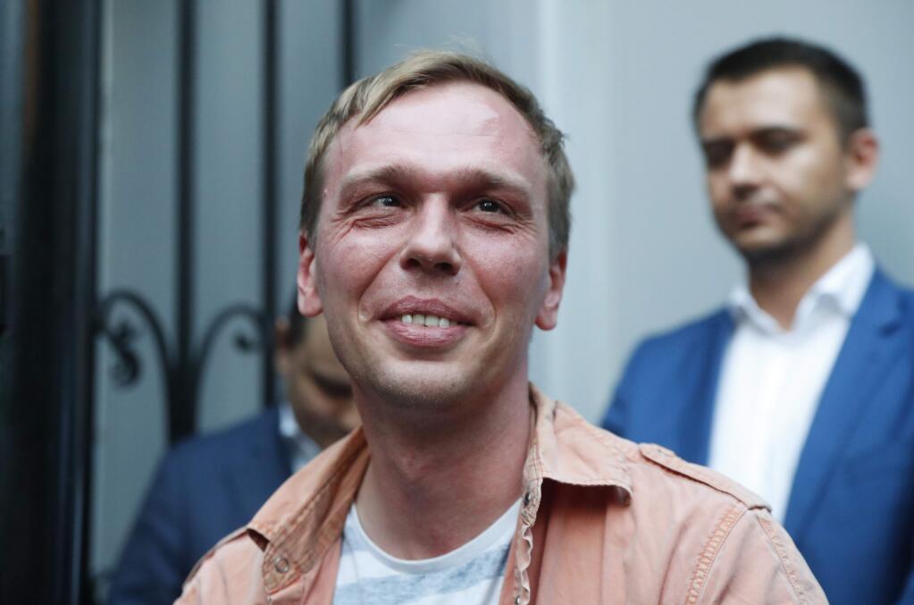 Prominent Russian investigative journalist Ivan Golunov, leaves a Investigative Committee building in Moscow, Russia, Tuesday, June 11, 2019. In a surprising turnaround, Russia's police chief on Tuesday dropped all charges against a prominent investigative reporter whose detention sparked public outrage and promised to go after the police officers who tried to frame the journalist as a drug-dealer. (AP Photo/Pavel Golovkin)