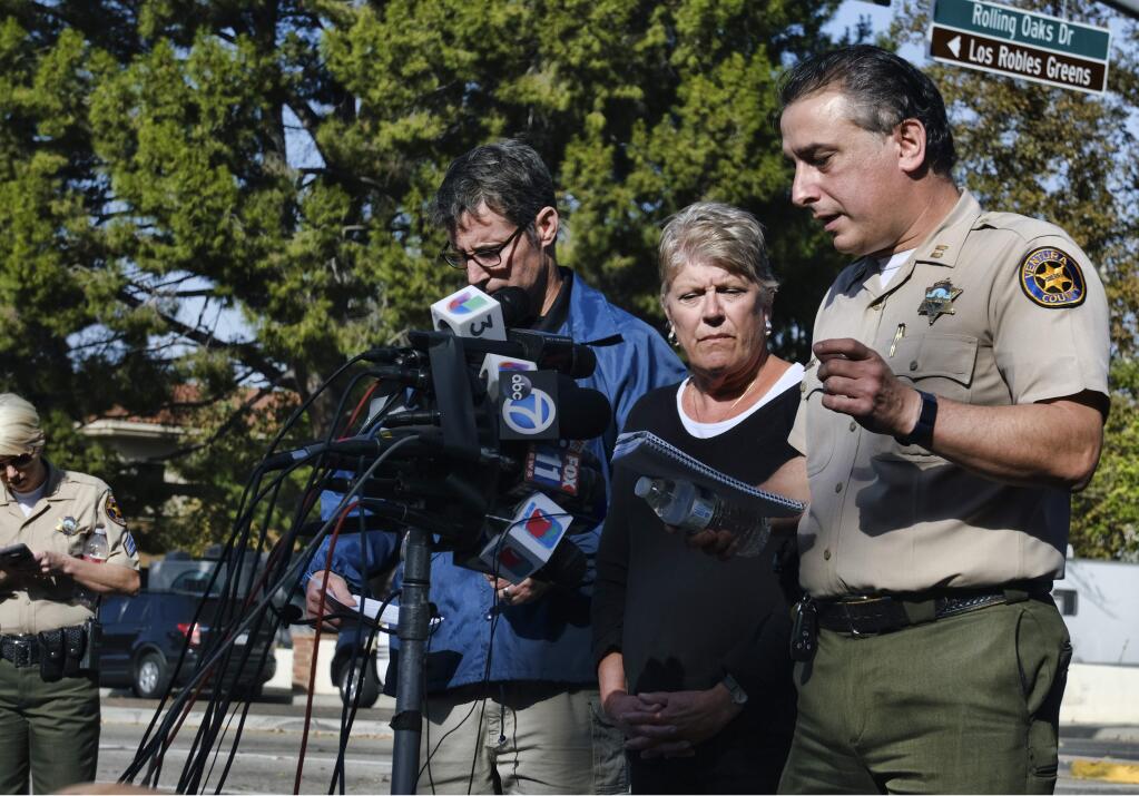 Standing at the microphones, from left to right, Paul Delacourt, assistant director for the FBI Los Angeles, and U.S. Rep. Julia Brownley look on as Ventura County Sheriff's Capt. Garo Kuredjian speaks to the media, Thursday, Nov. 8, 2018, in Thousand Oaks, Calif. Multiple people were fatally shot late Wednesday by the gunman who opened fire at the Borderline Bar and Grill, which was holding a weekly country music dance night for college students. (AP Photo/Richard Vogel)
