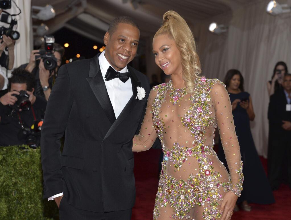 FILE - In this May 4, 2015, file photo, Jay Z, left, and Beyonce arrive at The Metropolitan Museum of Art's Costume Institute benefit gala celebrating 'China: Through the Looking Glass' in New York. (Photo by Evan Agostini/Invision/AP, File)