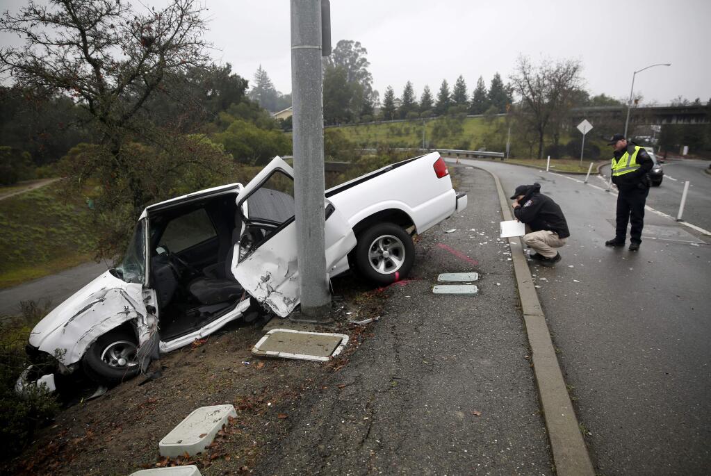 Santa Rosa police investigate the scene of a fatal car accident on Fountaingrove Parkway near the intersection with Bicentennial Way on Sunday, January 3, 2016 in Santa Rosa, California . (BETH SCHLANKER/ The Press Democrat)