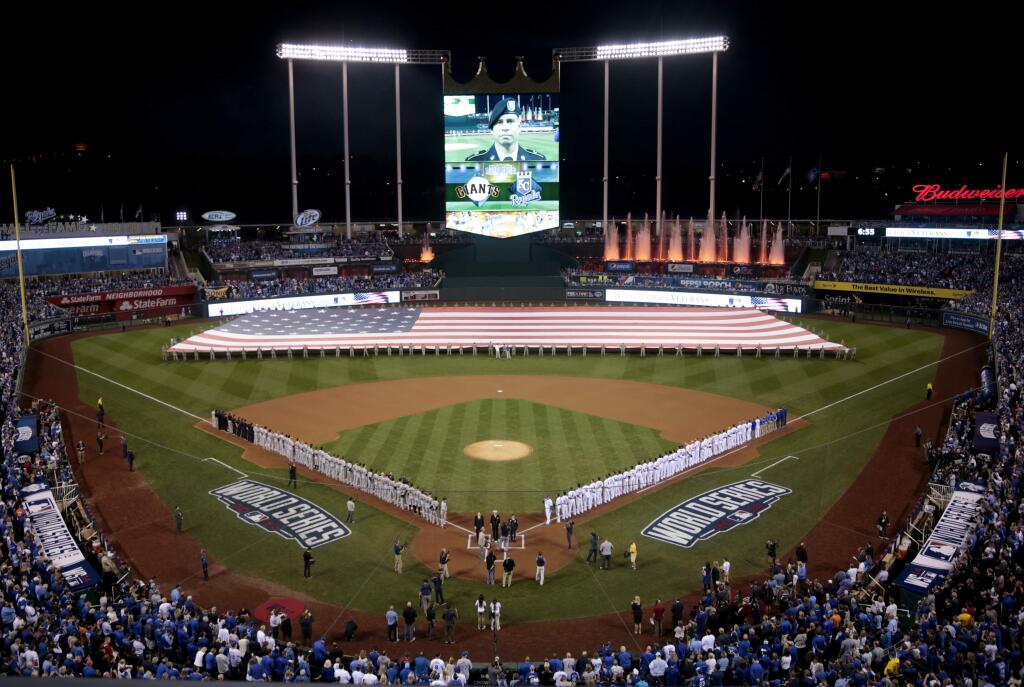 The national anthem is played during Game 1 of the World Series at Kauffman Stadium near Kansas City, Missouri on Tuesday, Oct. 21, 2014. (BETH SCHLANKER/ PD)