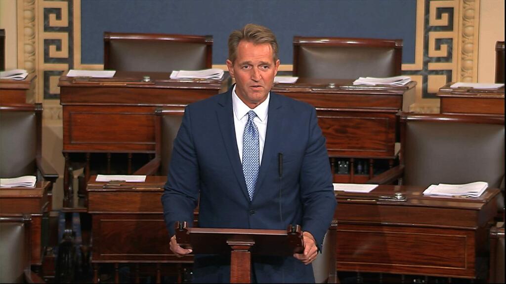 In this image from video from Senate Television, Sen. Jeff Flake, R-Ariz., speaks on the Senate floor Tuesday, Oct. 24, 2017, at the Capitol in Washington. Flake announced he will not run for re-election in 2018. (Senate TV via AP)