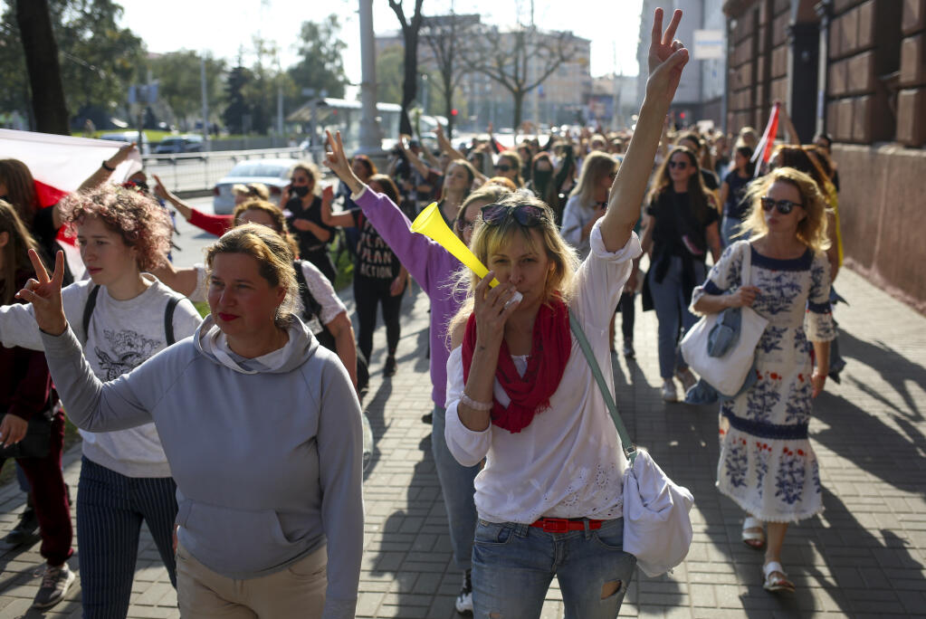 Belarusian women attend an opposition rally to protest the official presidential election results in Minsk, Belarus, Saturday, Sept. 26, 2020. Hundreds of thousands of Belarusians have been protesting daily since the Aug. 9 presidential election. (AP Photo/TUT.by)