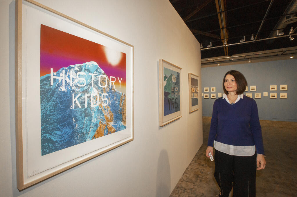Linda Keaton, executive director of the Sonoma Valley Museum of Art, with prints by renowned Armerican artist Ed Ruscha.  (Photo by Robbi Pengelly/Index-Tribune)