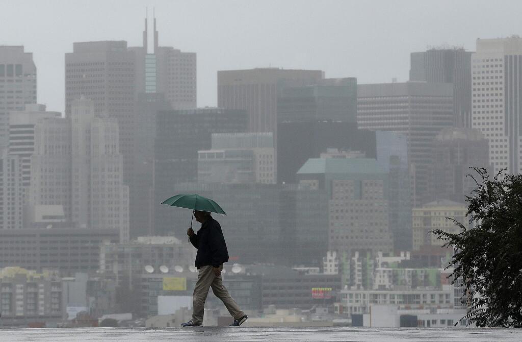 FILE - In this Tuesday, Jan. 5, 2016 file photo, Richard Polich holds an umbrella as he crosses a street in the rain in San Francisco. Taking a regional approach to saving water in Californias drought, state regulators may propose relaxing conservation orders for El Nino-soaked Northern Californians, while keeping in place more strict rules for residents of the drier Southern California. (AP Photo/Jeff Chiu)