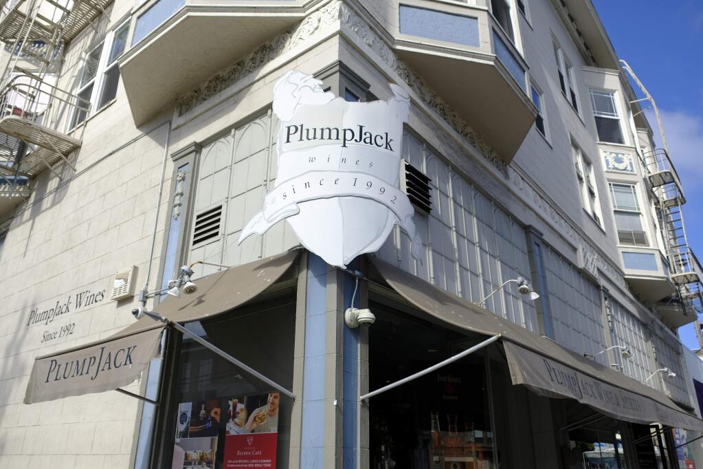This Monday, Oct. 22, 2018 photo shows the Plumpjack Wine & Spirits store, in San Francisco, part of the Plumpjack Group collection of wineries, bars, restaurants, hotels and liquors stores. Plumpjack was co-founded and is still partially owned by Lt. Gov. Gavin Newsom, the favorite in the California's governor's race. Newsom is adamant he won't sell his interests but otherwise is deferring decisions about how to handle potential conflicts until after the election. (AP Photo/Eric Risberg)