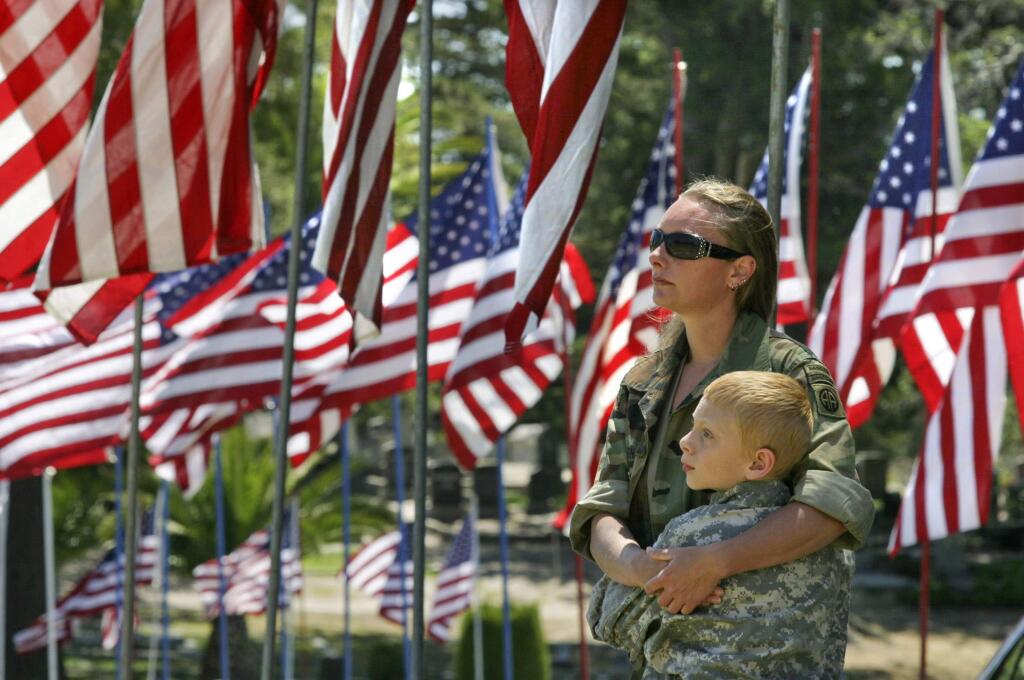 Anna Carney and her son Randy, 10, of Foresthill, stand during the 2014 Memorial Day Event in Petaluma. (SCOTT MANCHESTER/ARGUS-COURIER FILE PHOTO)