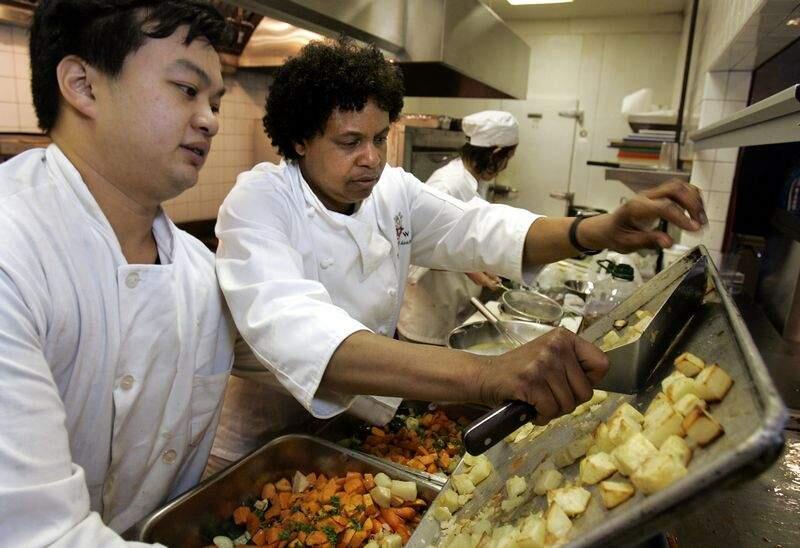 1 of 4__Evelyn Cheatham, center, helps Yi Kang Han, left, with roast vegetables while Melody Golobil, right, works on salad at Worth Our Weight, a culinary program for at-risk kids in their new space in dowtown Santa Rosa. photo by John Burgess/The Press Democrat