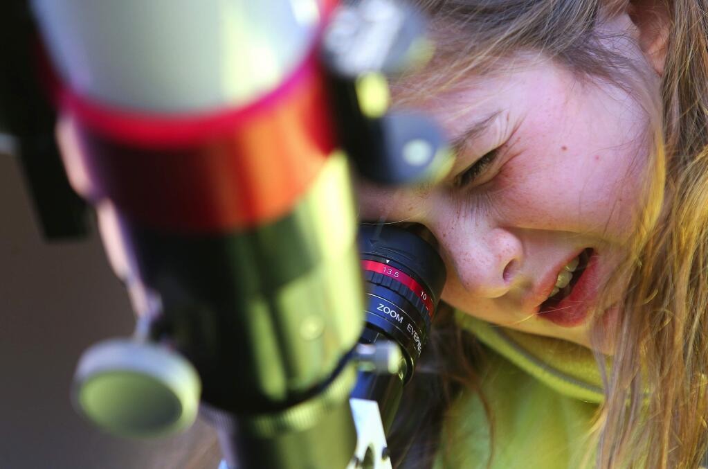 Sonny Calder, 9, looks at a solar prominence through a telescope at the Robert Ferguson Observatory, at Sugarloaf Ridge State Park during a solar viewing event in 2016. The observatory has public solar viewing on the same days as their evening Star Parties every month. (Christopher Chung/ The Press Democrat)