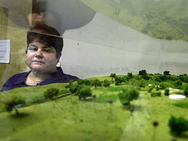Margie Mejia, chairperson for Lytton Rancheria, stands near the model that shows how the 50 acres of land on Windsor River Road would be developed for Lytton Band of Pomo Indians. (PRESS DEMOCRAT FILE PHOTO)