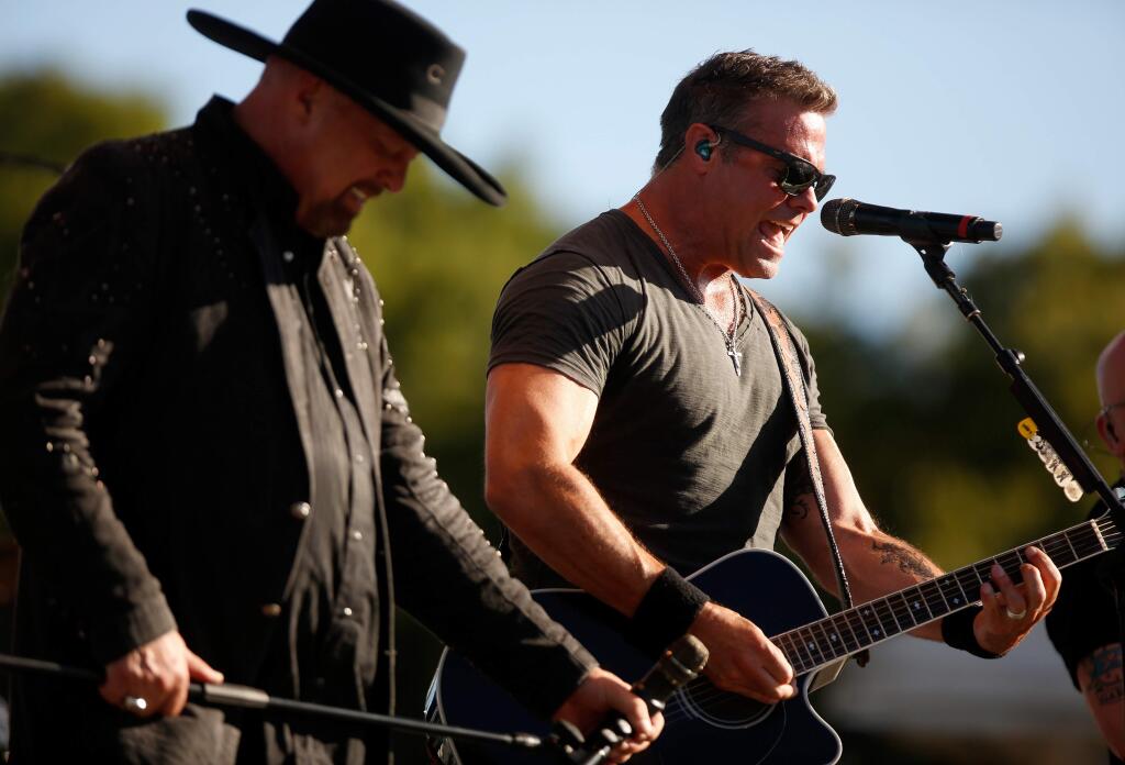 Country music duo Montgomery Gentry, Eddie Montgomery, at left, and Troy Gentry perform on stage during day two of Country Summer at the Sonoma County Fairgrounds in Santa Rosa, California, on Saturday, June 17, 2017. (Alvin Jornada / The Press Democrat)