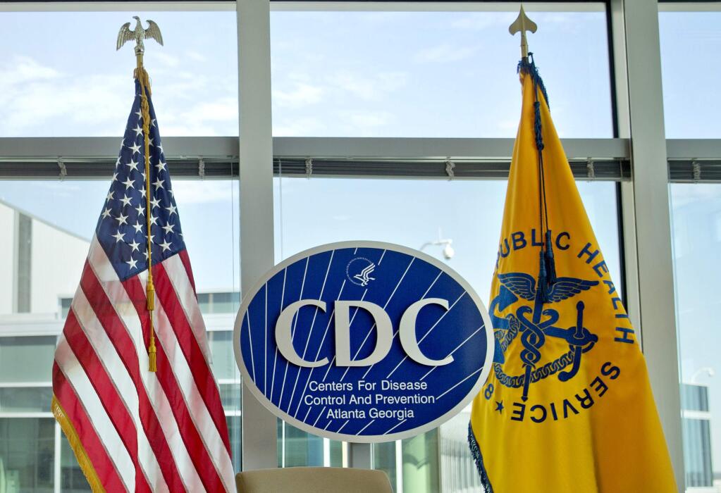 FILE - This Nov. 19, 2013 file photo shows a Centers for Disease Control and Prevention logo at the agency's federal headquarters in Atlanta. Reacting to a Friday, Dec. 15, 2017 story in The Washington Post, health leaders say they are alarmed that officials at the CDC, the nation's top public health agency, are being told not to use certain words or phrases in official budget documents, including 'fetus,' ''transgender' and 'science-based.' (AP Photo/David Goldman, File)