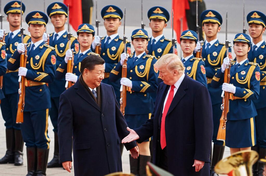 China's President Xi Jinping and President Donald Trump shake hands during a meeting outside the Great Hall of the People in Beijing. (ARTYOM IVANOV / Tass, 2017)