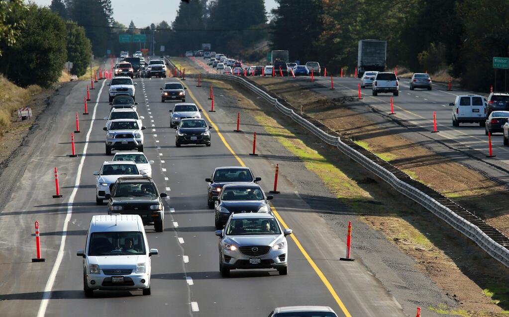 Caltrans added red traffic guides along Hwy 101 between Windsor and Healdsburg to aid nighttime visibility on the newly paved section of road. (photo by John Burgess/The Press Democrat)