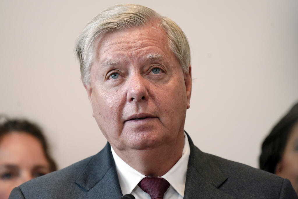 FILE - Sen. Lindsey Graham, R-S.C., speak during a news conference on Capitol Hill, Sept. 13, 2022, in Washington. Supreme Court Justice Clarence Thomas on Monday, Oct. 24, temporarily blocked Graham's testimony to a special grand jury investigating whether then-President Donald Trump and others illegally tried to influence the 2020 election in the state. (AP Photo/Mariam Zuhaib, File)