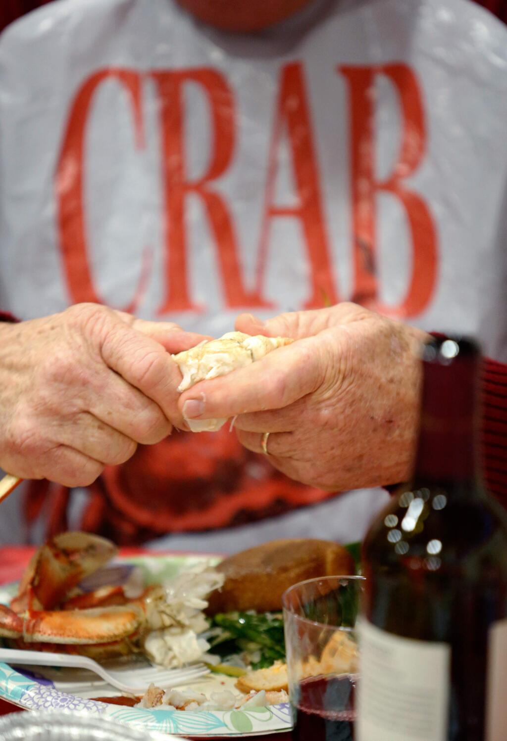 Rohnert Park Chamber of Commerce member Gary Tatman enjoys some fresh-cooked, hot crab that was caught in Oregon, during the Rohnert Park Chamber of Commerce Crab Feed in Rohnert Park, California on Saturday, January 9, 2016. (Alvin Jornada / The Press Democrat)
