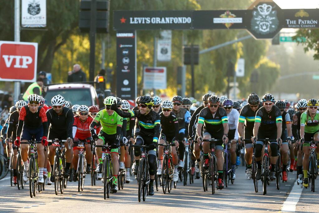 Levi Leipheimer, center, gives a thumbs-up as the peloton gets rolling during Levi's GranFondo, in Santa Rosa, California on Saturday, Oct. 1, 2016. (Alvin Jornada / The Press Democrat)