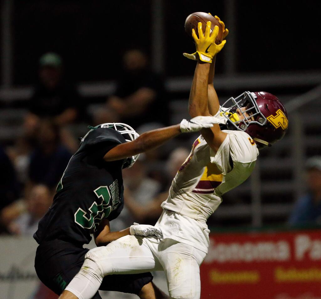 Piner's Isaac Torres, right, pulls down a touchdown catch while guarded by Sonoma Valley's Adair Gallardo during the first half in Sonoma on Friday, Sept. 13, 2019. (Alvin Jornada / The Press Democrat)