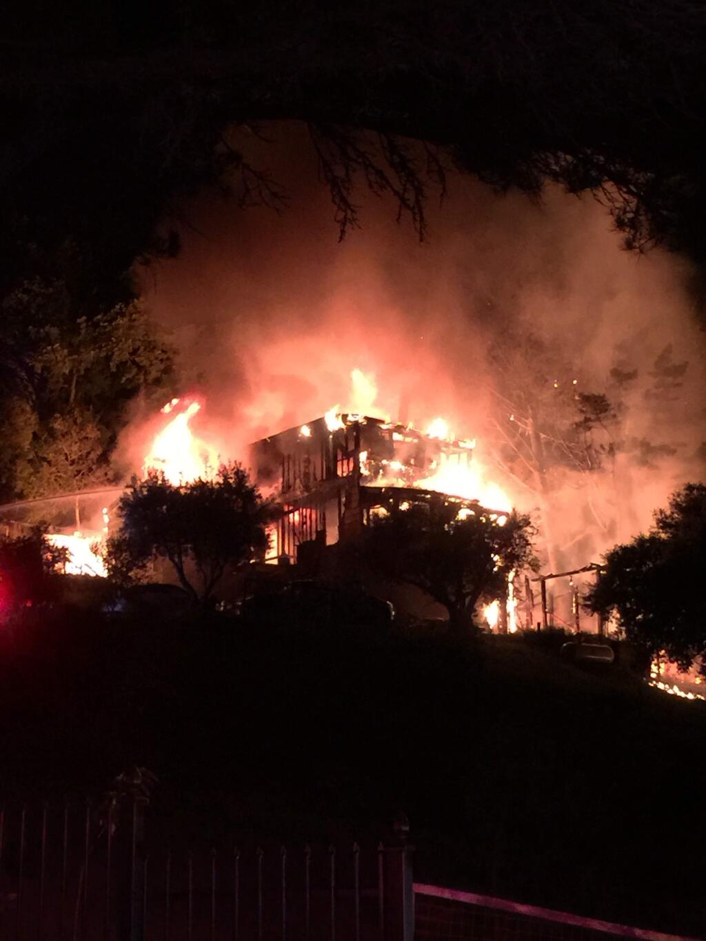 A three-story vacation home in Sonoma Valley's Diamond A neighborhood destroyed by fire early Sunday morning. Photo by Ted Hassler.