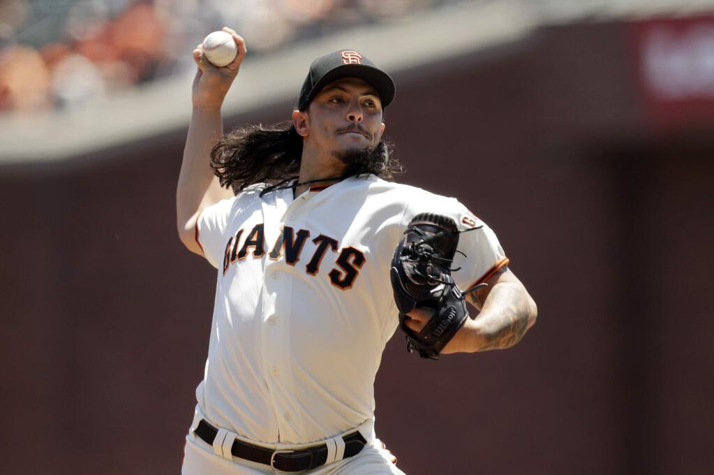 San Francisco Giants starting pitcher Dereck Rodriguez throws to the San Francisco Giants during the first inning of a baseball game Sunday, June 24, 2018, in San Francisco. (AP Photo/Marcio Jose Sanchez)