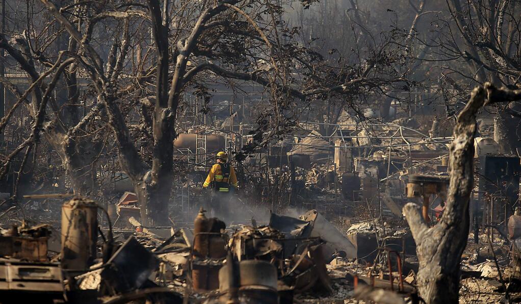 The Clayton fire caused immense devastation on Winchester Street in Lower Lake, Monday August 15, 2016 in Lake County. (Kent Porter / Press Democrat) 2016