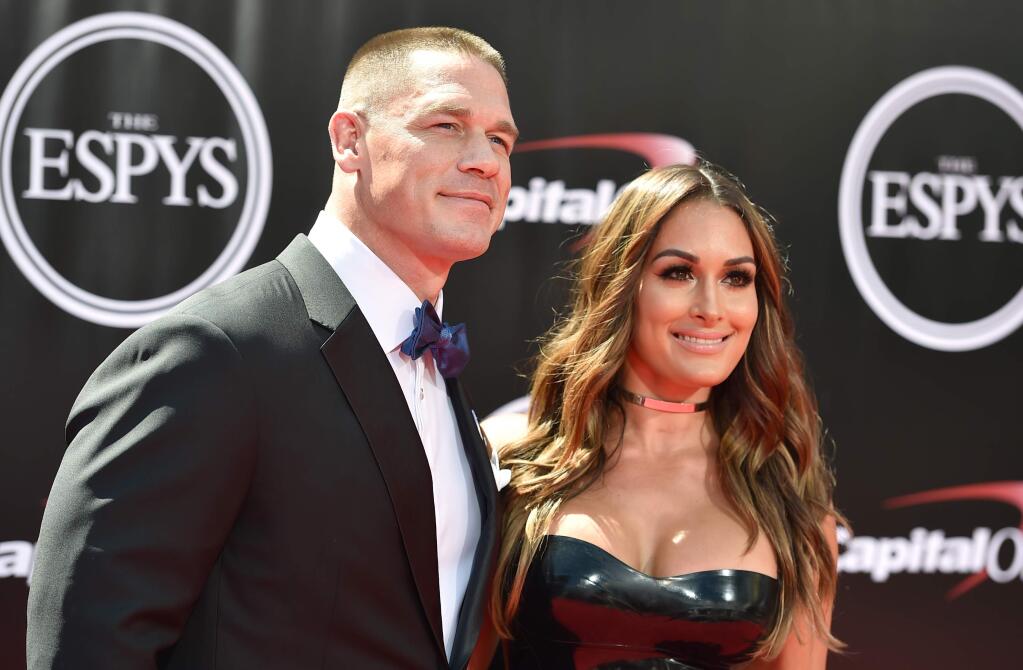 Professional wrestler/actor John Cena, left, and professional wrestler Nikki Bella, arrive at the ESPY Awards at the Microsoft Theater on Wednesday, July 13, 2016, in Los Angeles. (Photo by Jordan Strauss/Invision/AP)