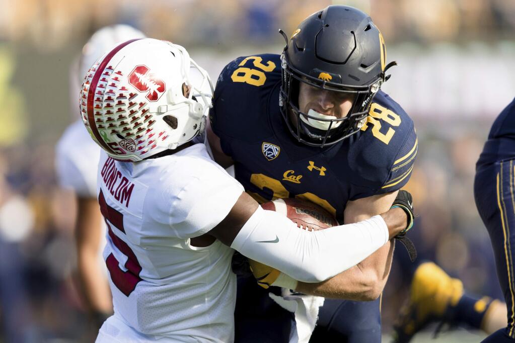 Stanford Cardinal safety Frank Buncom (5) tackles California Golden Bears running back Patrick Laird (28) in the second quarter of a football game in Berkeley, Calif., Saturday, Dec. 1, 2018. (AP Photo/John Hefti)