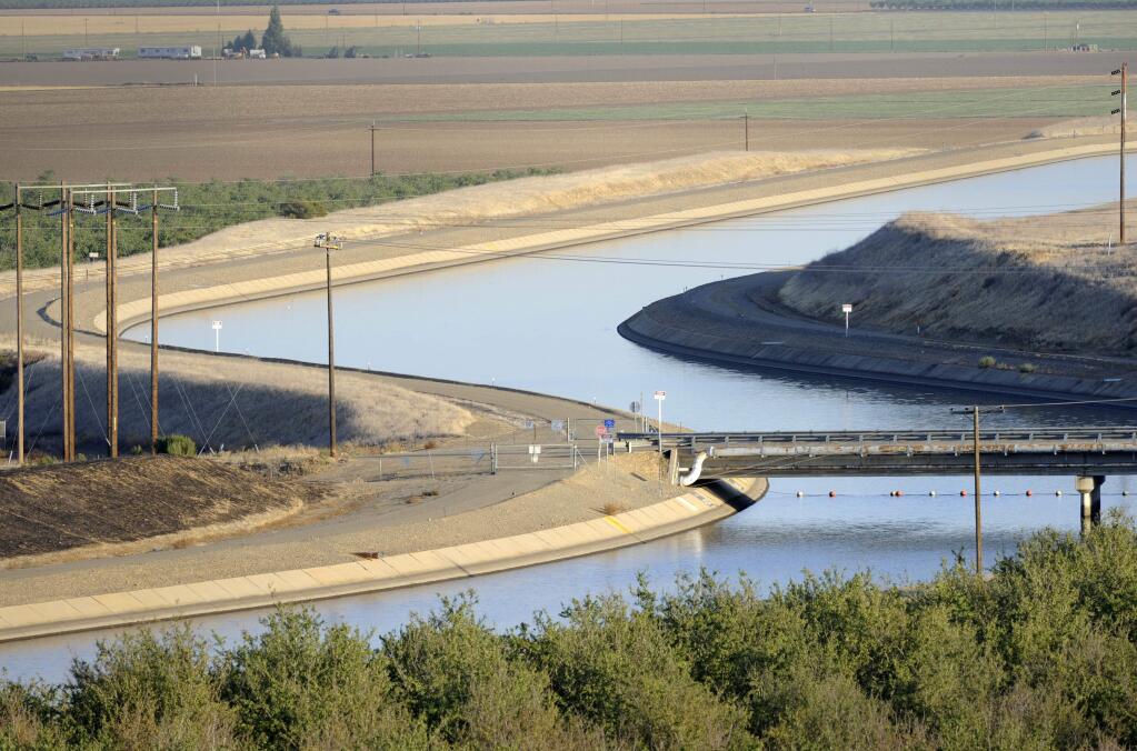 Canals carry water to southern California in the Central Valley’s Westland Water District. The State Water Resources Control Board on Friday released an "emergency curtailment" order that would cut thousands off from rivers and streams in the Sacramento and San Joaquin river watersheds. (AP Photo/Russel A. Daniels, File)