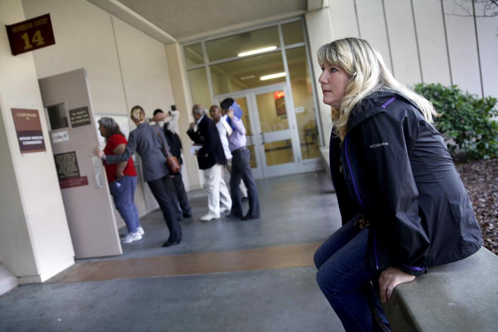 Cheryl Copping, who is living at the Mary Isaak center in Petaluma, sits before going into the homeless court at the Hall of Justice in Santa Rosa, on Thursday, April 14, 2016. (BETH SCHLANKER/ The Press Democrat)