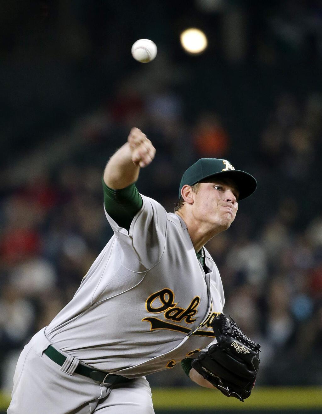 Oakland Athletics starting pitcher Aaron Brooks throws against the Seattle Mariners in the second inning of a baseball game Friday, Oct. 2, 2015, in Seattle. (AP Photo/Elaine Thompson)