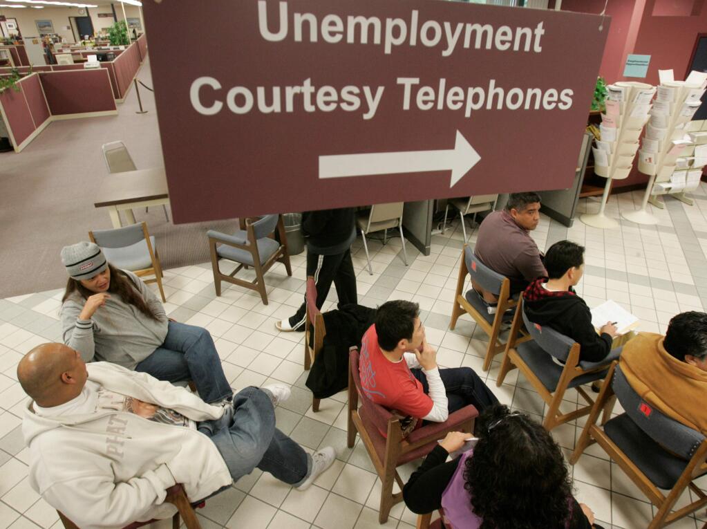 People wait their turn to talk with unemployment benefits staff at an Employment Development Department office in San Jose, Calif., Friday, Jan. 23, 2009.(AP Photo/Marcio Jose Sanchez)