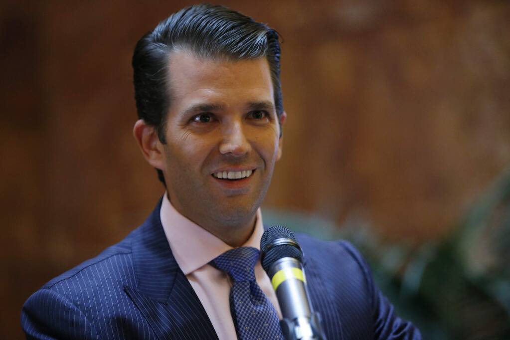 FILE - In this June 5, 2017, file photo, Donald Trump Jr., executive vice president of The Trump Organization, announces that the family's company is launching a new hotel chain inspired by his and brother Eric's Trump's travels with their father's campaign at Trump Tower in New York. Trump Jr. shared a video on July 8, 2017, of an edited clip of the 1986 military thriller “Top Gun” in which President Donald Trump's face is superimposed over Tom Cruise's character as he shoots down a Russian jet with a CNN logo on it. (AP Photo/Kathy Willens, File)