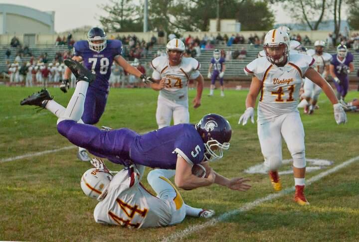 JOHN O'HARA/FOR THE ARGUS-COURIERPetaluma quarterback Brendan White dives into the end zone, but the touchdown was nullfied by a holding penalty in a game won by Viintage, 48-19.