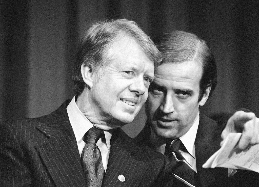 President Jimmy Carter listens to Sen. Joe Biden as they wait to speak at a 1978 fundraising reception in Wilmington, Delaware. (BARRT THUMMA / Associated Press)