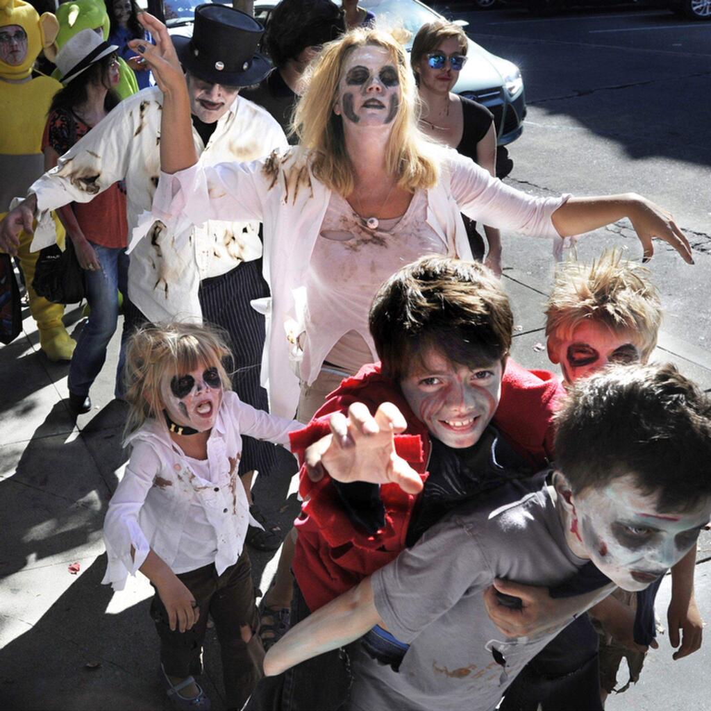 Over 40 zombies, zombie fans and zombie hunters converge at Copperfield's Books Saturday, for a walk, en masse, through downtown Petaluma. Led by bookstore marketing and special events director Vicki De Armon, the crowd lurched out of the Kentucky Street store and down Bodega Avenue, then continued south on Petaluma Boulevard through the Theatre District. After invading the Saturday Farmer's Market at Walnut Park, the group passed diners at McNears Restaurant for a second time, then completed their loop and staggered up Western Avenue to reconvene at the store for festivities. This is the third annual Zombie Walk, which also is held at other Copperfield's locations.