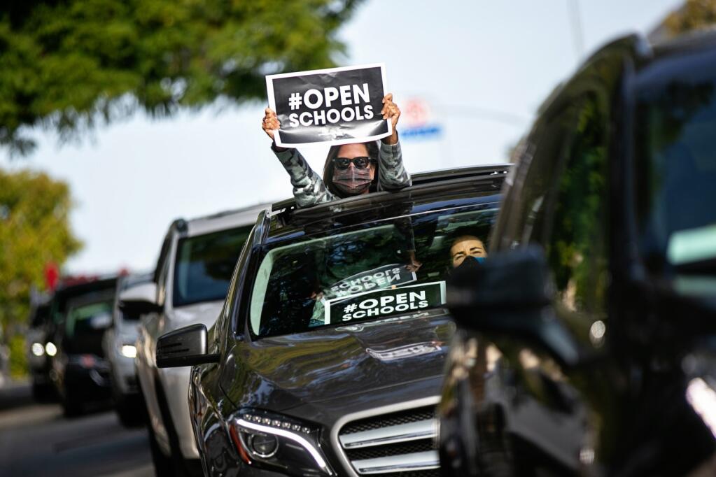 Los Angeles parents participate in a Feb. 15 car caravan in support of reopening schools.  (JASON ARMOND / Los Angeles Times)