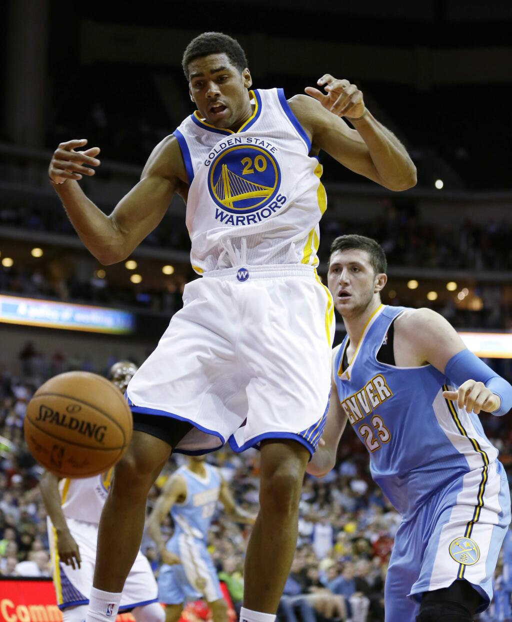 Golden State Warriors forward James Michael McAdoo, left, loses the ball in front of Denver Nuggets center Jusuf Nurkic during the second half of a preseason NBA basketball game, Thursday, Oct. 16, 2014, in Des Moines, Iowa. Golden State won 104-101. (AP Photo/Charlie Neibergall)