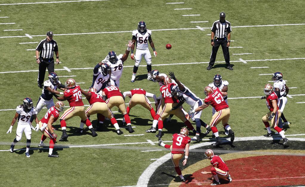 In this Aug. 17, 2014 photo, San Francisco 49ers kicker Phil Dawson (9) misses a field goal during the first half of an NFL preseason football game against the Denver Broncos in Santa Clara, Calif. Dawson, who missed two field goals in Sunday's 34-0 loss to Denver, planned to return to Levi's Stadium on Tuesday afternoon to get back to work figuring out a new field and its quirks. (AP Photo/Tony Avelar)