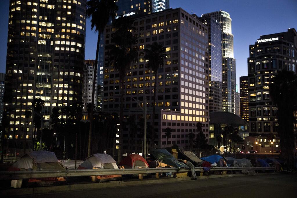 Homeless tents are dwarfed by skyscrapers in Los Angeles. (JAE C. HONG / Associated Press, 2017)