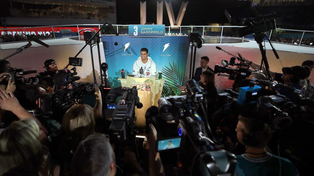 San Francisco 49ers quarterback Jimmie Garoppolo faces the the worlds media, Monday, Jan. 27, 2020 during Super Bowl LIV Opening Night at Marlins Park in Miami. (Kent Porter / The Press Democrat) 2020