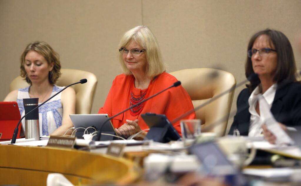 1st District Supervisor Susan Gorin, center, 5th District Supervisor Lynda Hopkins, left, and Sheryl Bratton, the Sonoma County Administrator, right, attend the Sonoma County Board of Supervisors meeting in Santa Rosa on Tuesday, July 10, 2018. (Beth Schlanker/ The Press Democrat)