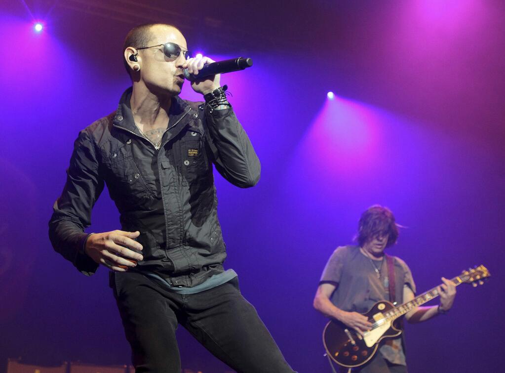 FILE - In this May 16, 2015, file photo, Chester Bennington, left, performs during the MMRBQ Music Festival 2015 at the Susquehanna Bank Center in Camden, N.J. (Photo by Owen Sweeney/Invision/AP, File)