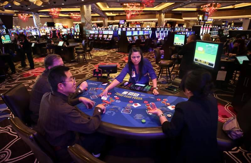 Raquel Dogan, center, Yee Chongok, right, and Mark Ma practice dealing table games at the Graton Resort & Casino in Rohnert Park on Tuesday, October 29, 2013.(Christopher Chung/ The Press Democrat)